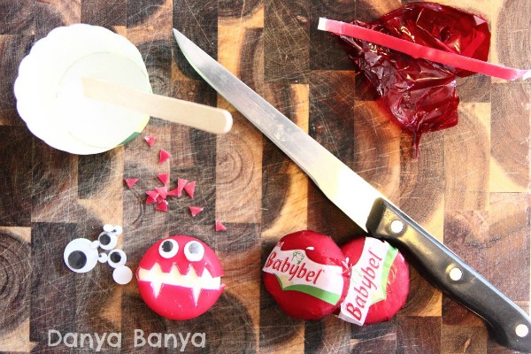 Glue, googly eyes, knife and babybel to make cheese monsters