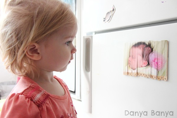 Staring at a puzzle of herself as a baby