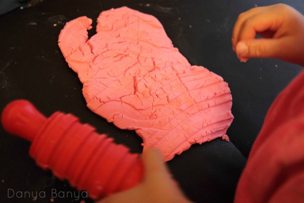 Playing with apple scented play dough
