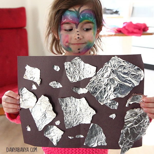 Tearing and pasting aluminium foil for fine motor play