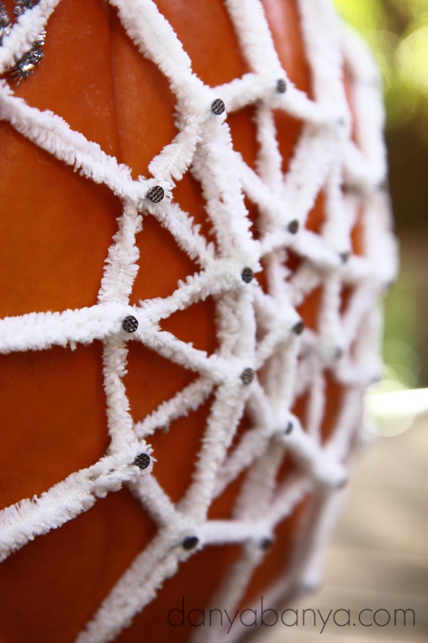 Close up of the yarn pumpkin geoboard