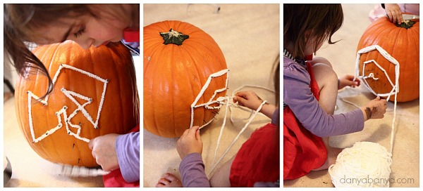 Threading yarn onto the pumpkin geoboard