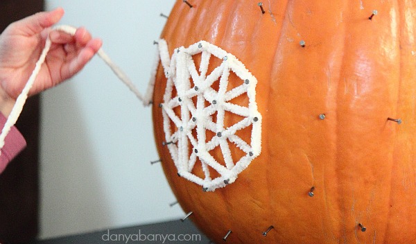 Unwrapping the pumpkin geoboard is just as much fun as wrapping it