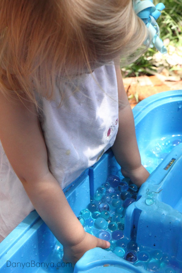Playing outside with water beads - great sensory play for a hot afternoon