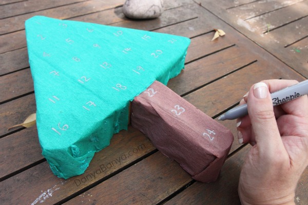 Use a metallic Sharpie to number the loo roll Christmas tree advent calendar