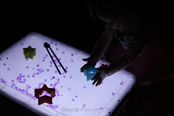 Water beads and star cutters on the light table