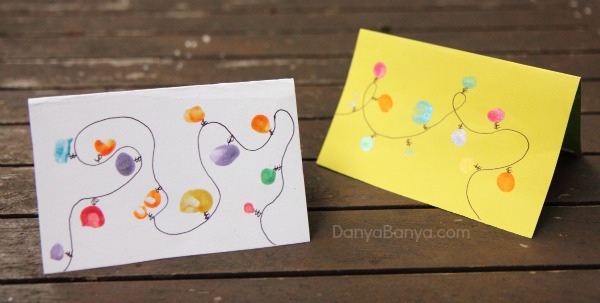 Christmas lights cards made using toddler and preschooler fingerprints