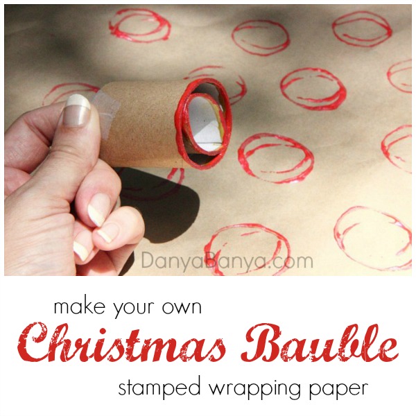 Make your own Christmas Bauble stamped wrapping paper, with a DIY toilet paper roll stamper - fun Christmas art idea for kids.