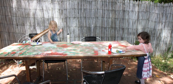 Painting with rollers to make DIY wrapping paper