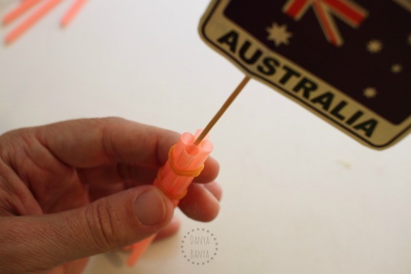 Inserting the flag between the straws
