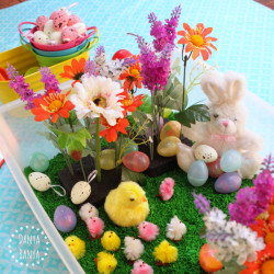 Easter sensory tub with chicks, eggs, flowers and of course, The Easter Bunny