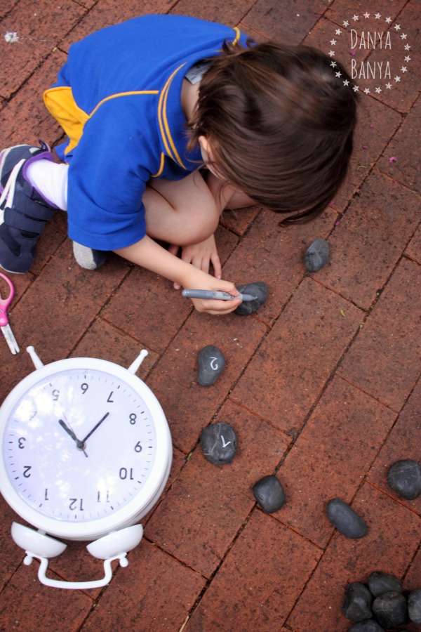 Make a rock clock - playful maths and writing skills activity for kids