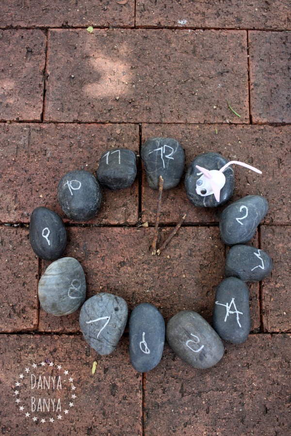 Rock clock and garden stone mouse to go with the nursery rhyme Hickory Dickory Dock