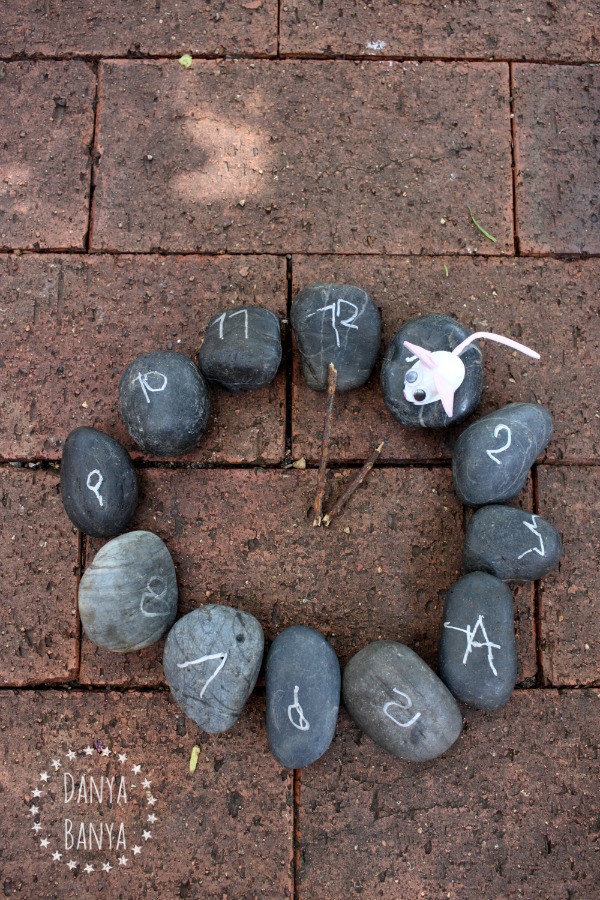 Rock clock and garden stone mouse to go with the nursery rhyme Hickory Dickory Dock