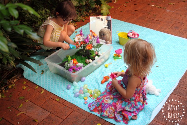 Scooping and pouring - sensory play in the backyard