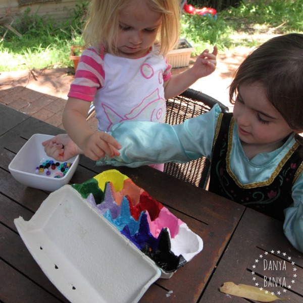 Toddler and preschooler colour sorting with pony beads
