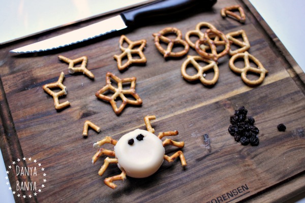 Making a healthy cheese incy wincy spider snack