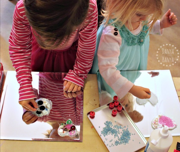 2 and 5 year old adding beads and sequins