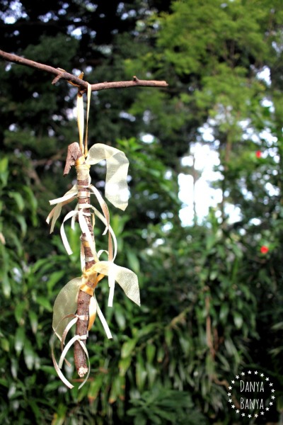 Kids can learn to tie knots while making this pretty gold ribbon stick ornament