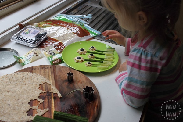 Adding cucumber and blueberry details to the flower snack