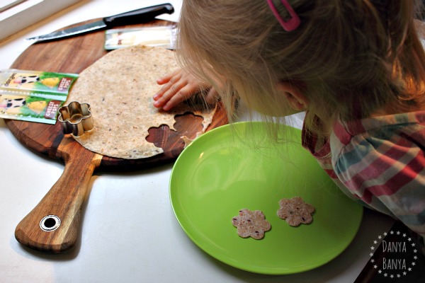 Toddlers can help cut multigrain wrap flower shapes