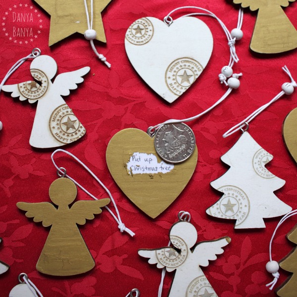 Scratch-off advent calendar idea using wooden Christmas ornaments