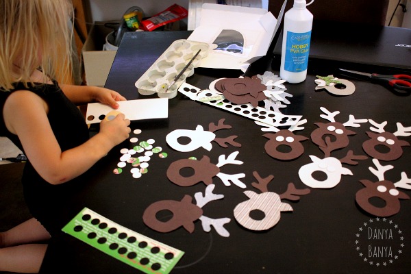 Cutting cardboard circle eyes