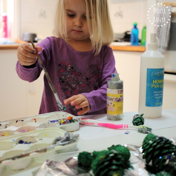 Glitter glue and pony bead sensory play