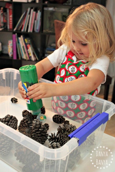 Painting pine cones sensory play