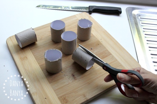 Cutting toilet paper rolls to size