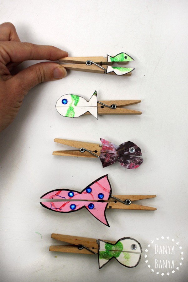 Fish pegs, made from upcycled kids art, that nibble fingers