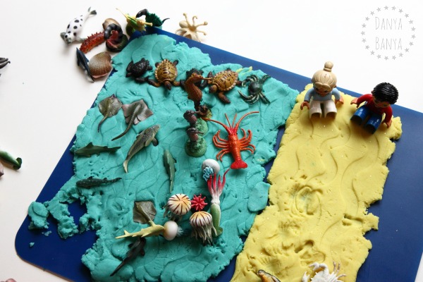 Ocean play dough with sea creatures and Duplo people on the beach