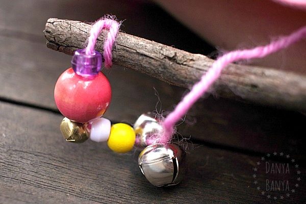 Making a jingle stick with beads, bells and wool (yarn)