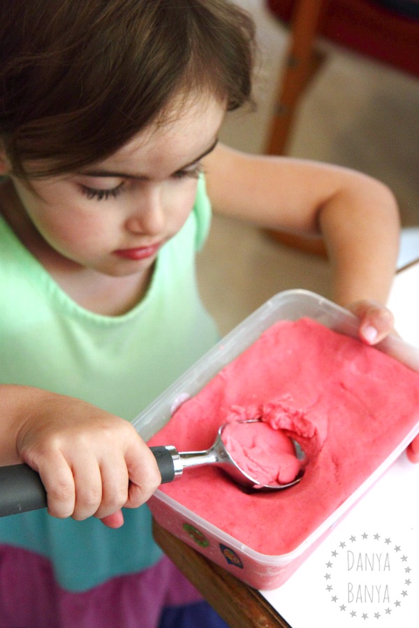 Scooping out strawberry ice cream playdough