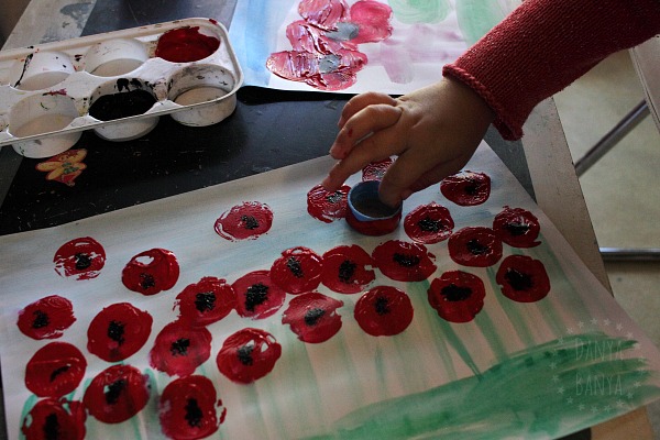 3-year-old-painting-poppies-with-a-bottle-cap-preschooler-art-for-anzac-day-or-remembrance-day