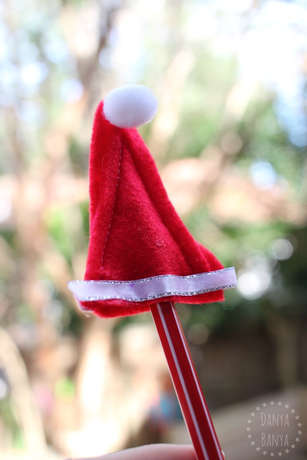 Homemade Santa hat pencil toppers - cute non-candy DIY Christmas gifts for kids to give their classmates or friends